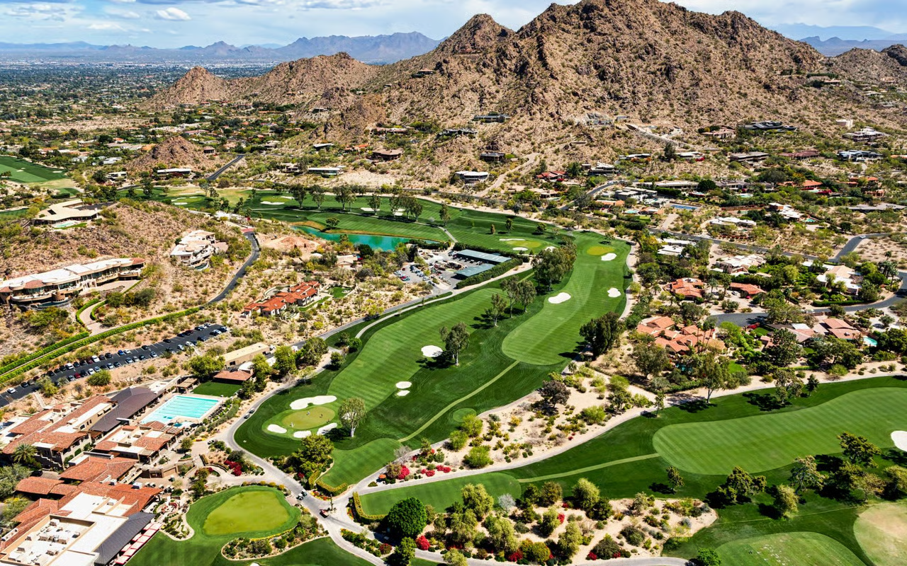 Aerial view of Paradise Valley, Arizona luxury golf course estates with Camelback Mountain backdrop